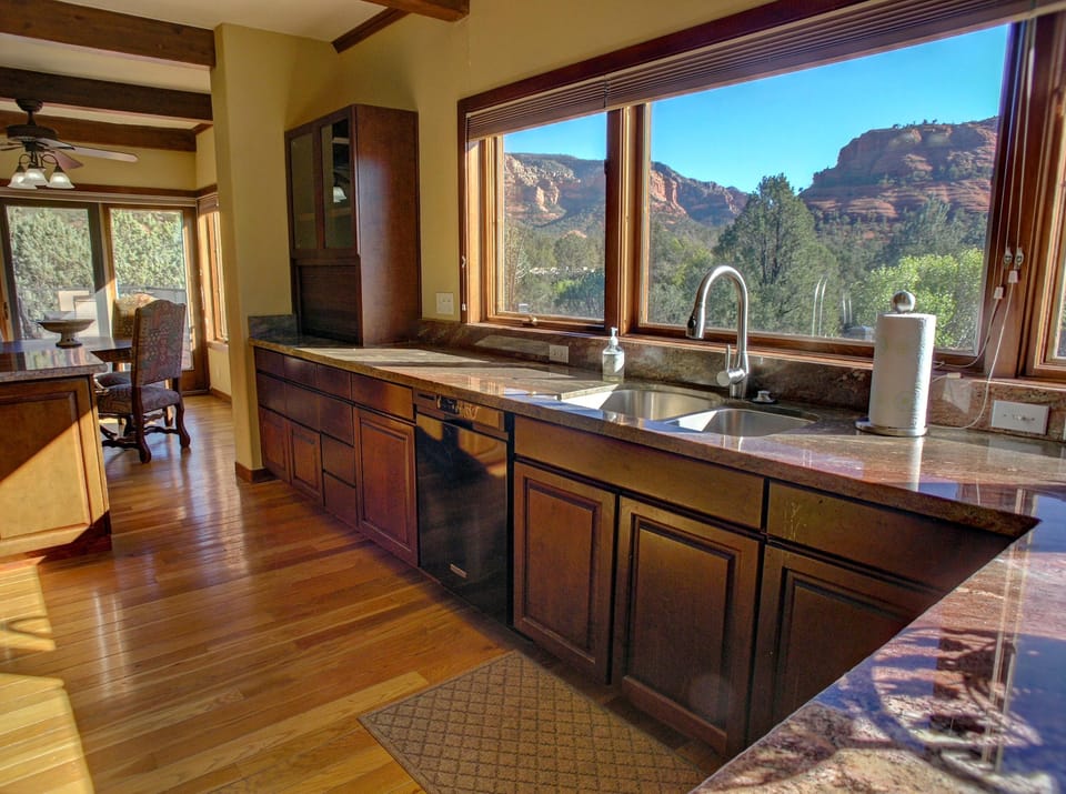 KITCHEN: Spacious room with lots of counter space, 2 refrigerators, 2 dishwashers and a Wolf gas range. Also offers up-close red rock views and  views of the red rock vista to the east named the Mogollon Rim.