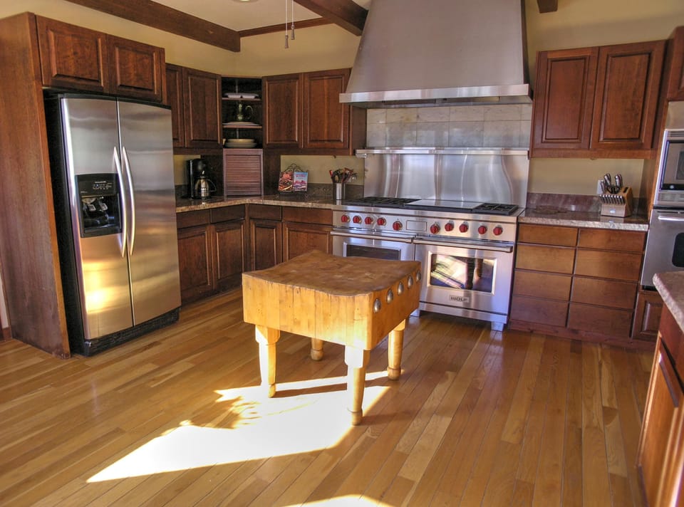 KITCHEN: Spacious room with lots of counter space, 2 refrigerators, 2 dishwashers and a Wolf gas range. Also offers up-close red rock views and  views of the red rock vista to the east named the Mogollon Rim.
