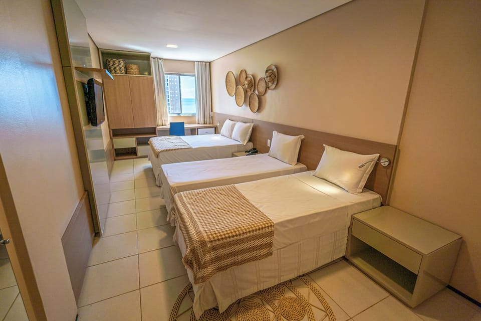 Family Room | Minibar, in-room safe, desk, blackout drapes