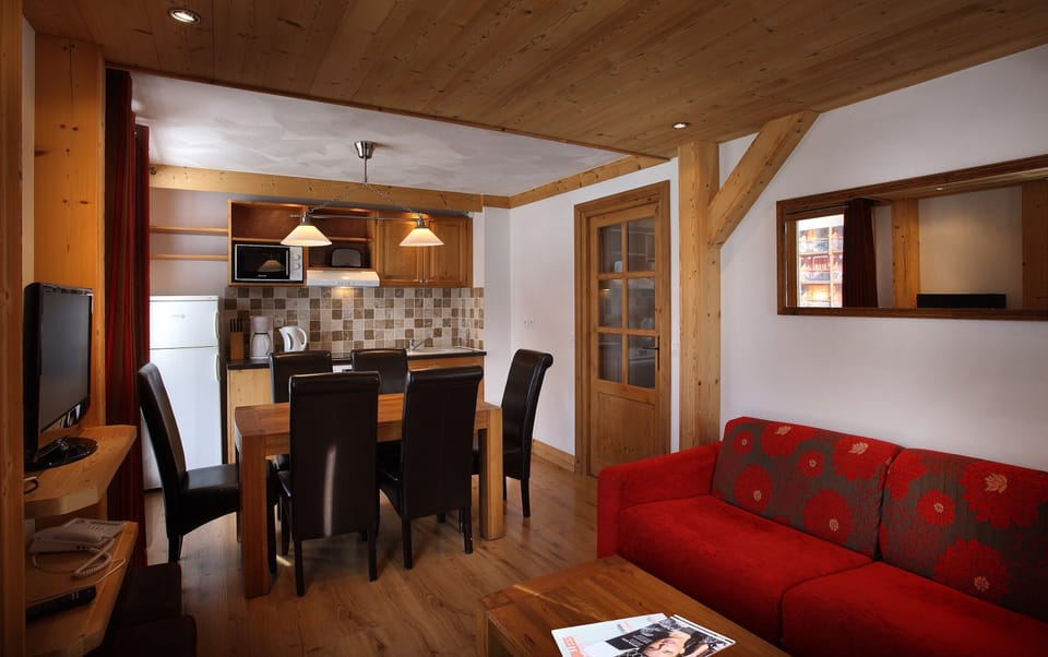 Prepare meals in the kitchenette and enjoy them at the dining table.