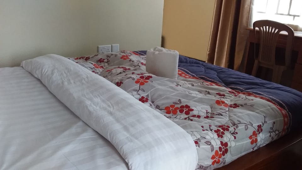 Desk, laptop workspace, free WiFi, bed sheets