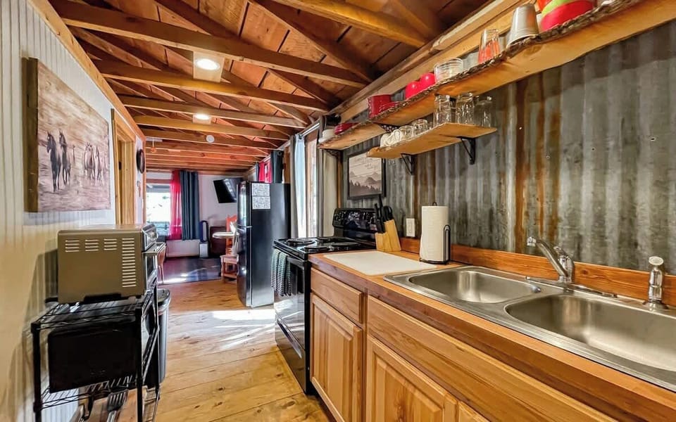 Our galley-style kitchen is well stocked and ready for use.