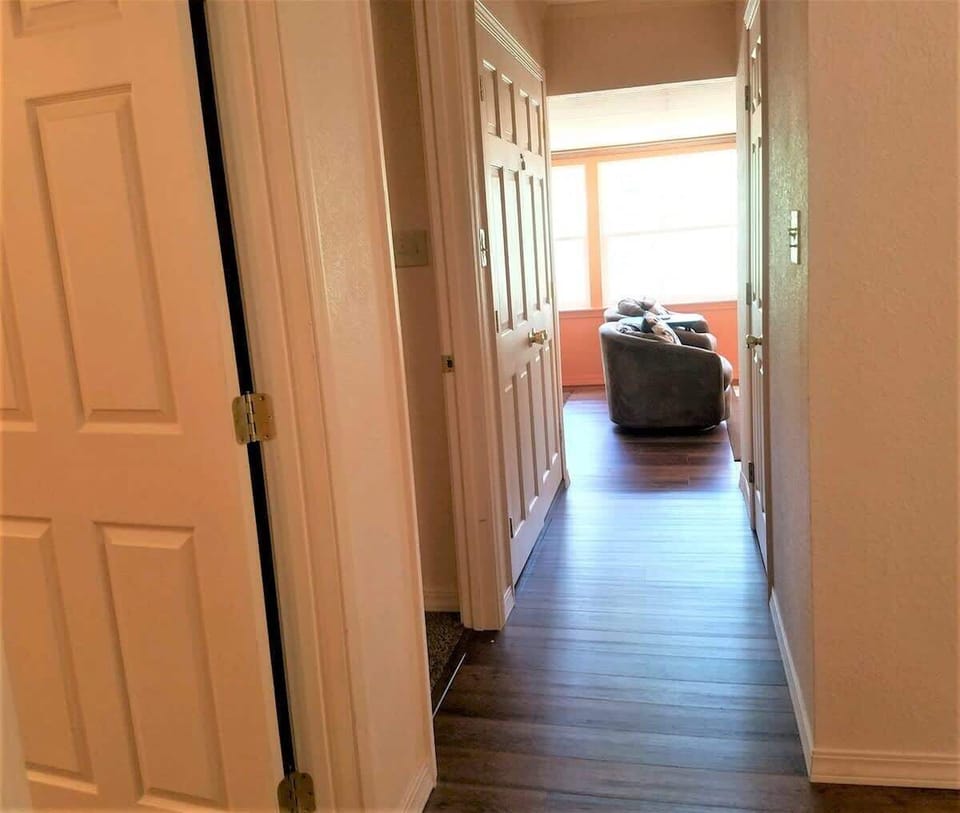 Hall to living room, bath off kitchen