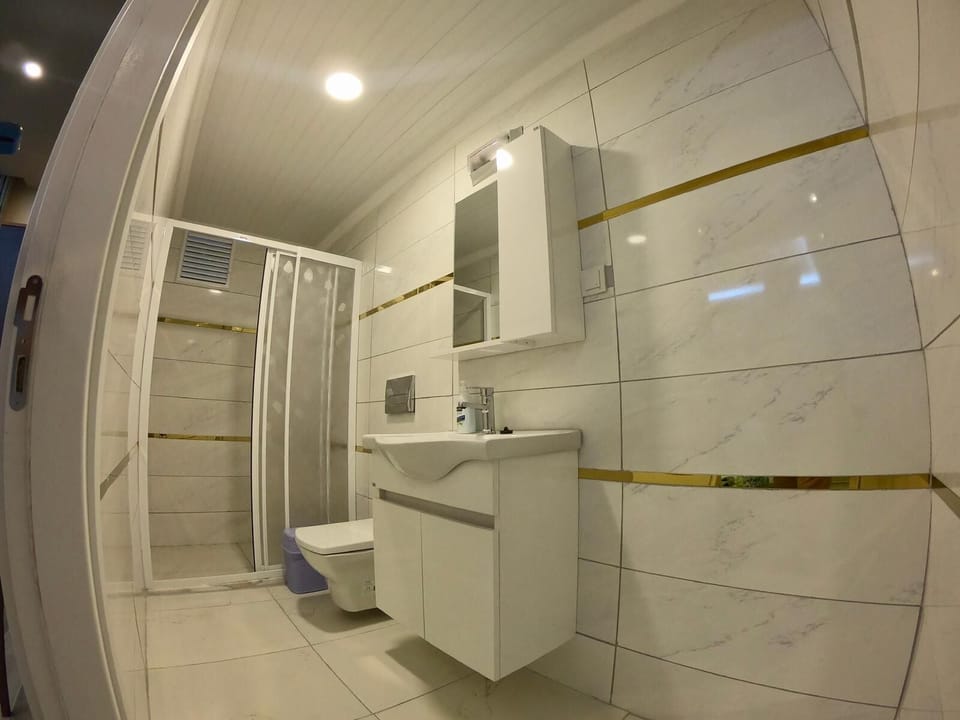 Triple Room, Balcony | Bathroom | Shower, rainfall showerhead, hair dryer, bathrobes