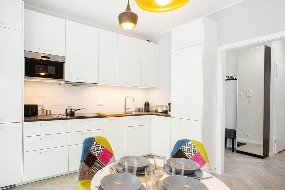 Kitchenette with dishwasher and refrigerator. 