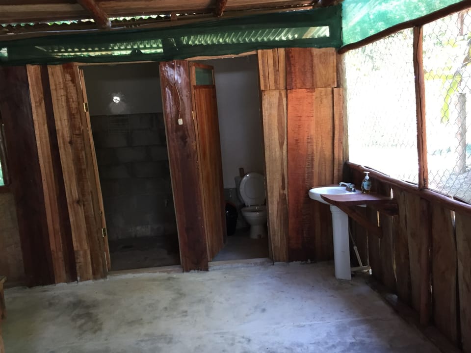 Economy Quadruple Room | Bathroom | Shower, rainfall showerhead, towels