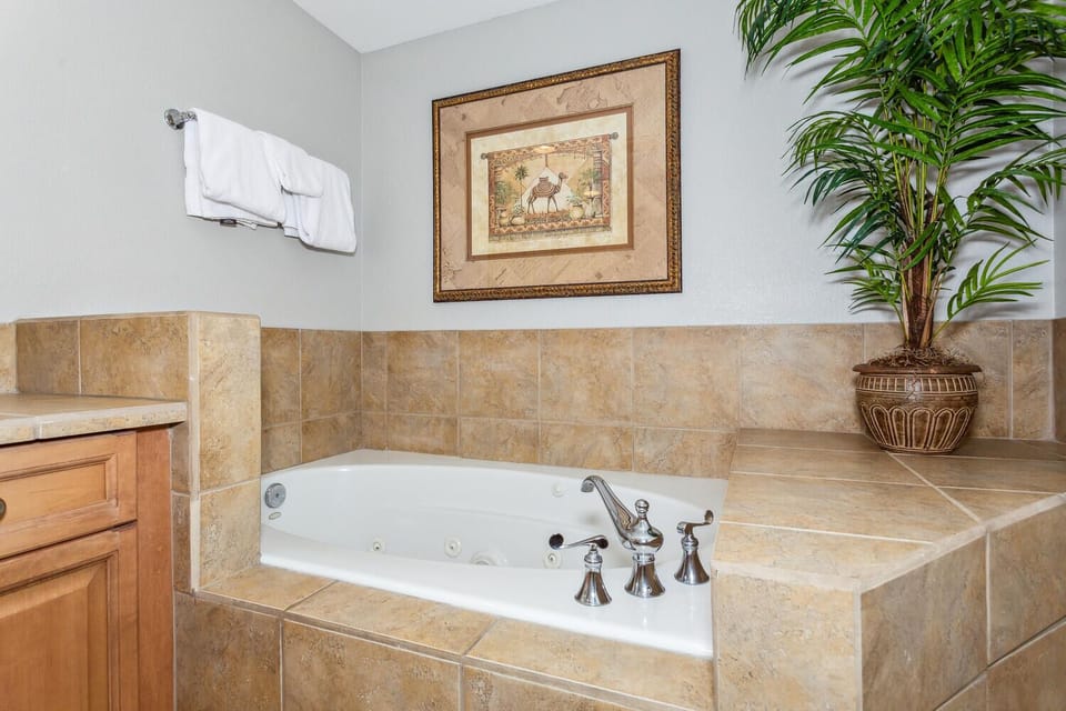 Slip into your private whirlpool tub after a long day of exploring. Warm tile, soft towels, and tropical greenery create a soothing retreat where you can truly unwind.