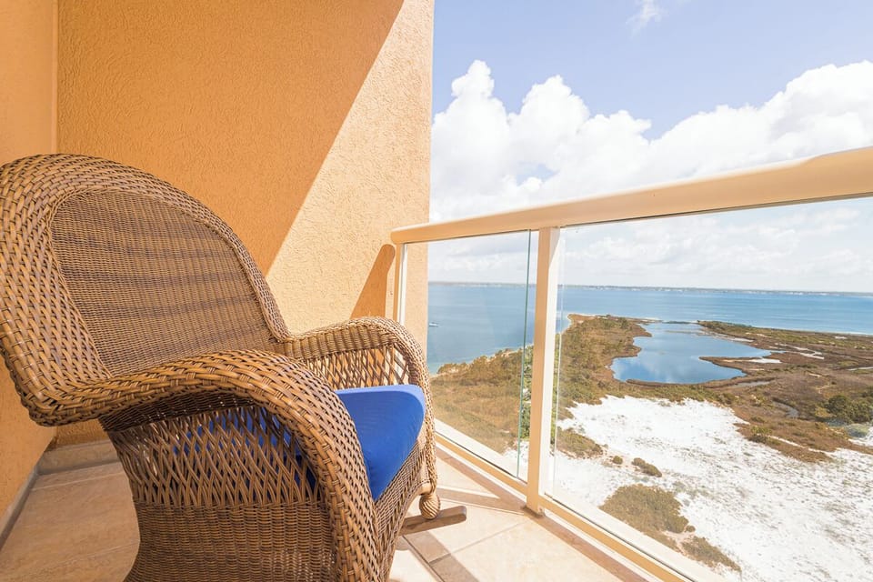 Settle into your private balcony and let the endless ocean horizon melt away your worries. With a cozy wicker chair and stunning coastal views, this is your front-row seat to paradise.