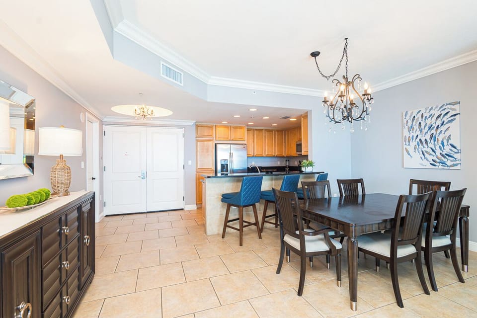 Step into your elegant open-concept space where coastal charm meets comfort. The fully equipped kitchen and stylish dining area create the perfect setting for your memorable gatherings.