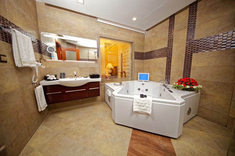 Separate tub and shower, free toiletries, hair dryer, slippers