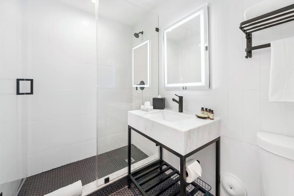 Shower, hair dryer, towels, soap