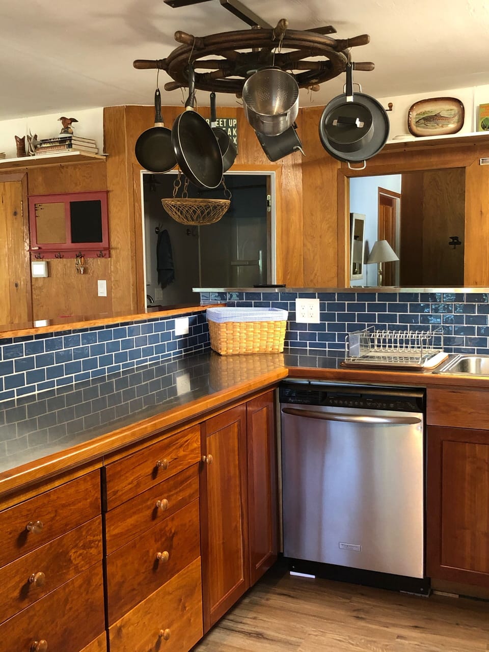 WW II ship helm repurposed as a pot rack, more history on the helm on site.  