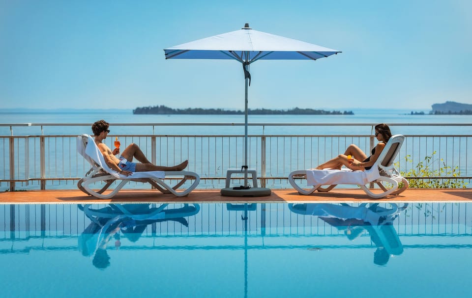 Seasonal outdoor pool, pool umbrellas, sun loungers