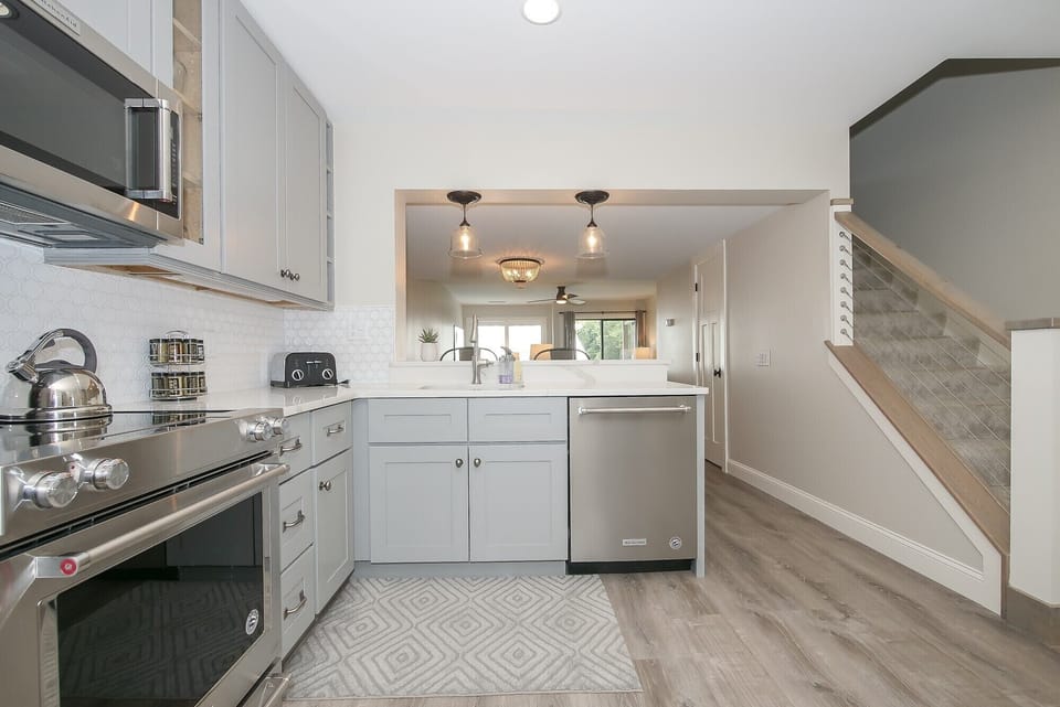 Courtside 42 - View of kitchen and stairs leading to 2nd floor. - View of kitchen and stairs leading to 2nd floor.