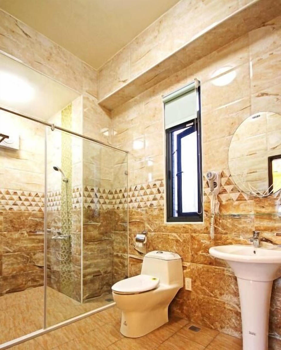 Shower, free toiletries, hair dryer, slippers