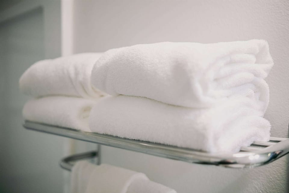 Desk, blackout drapes, iron/ironing board, free cribs/infant beds