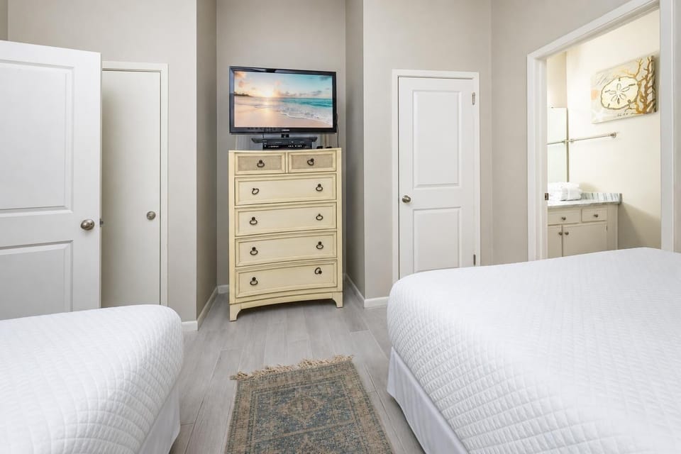 Unwind after a day at the beach with your favorite show in this cozy queen guest suite
