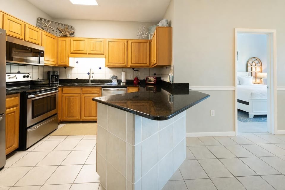 Smooth granite countertops gleam as you prepare snacks in the kitchen before retreating to the master suite