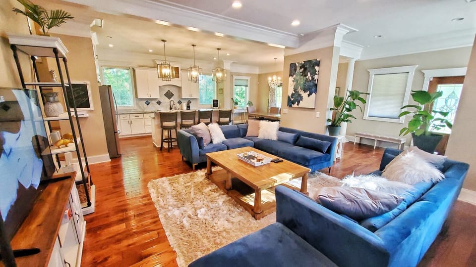 Wide Open Living Area Includes Giant Sectional, Kitchen, Bar Top & Dining Area