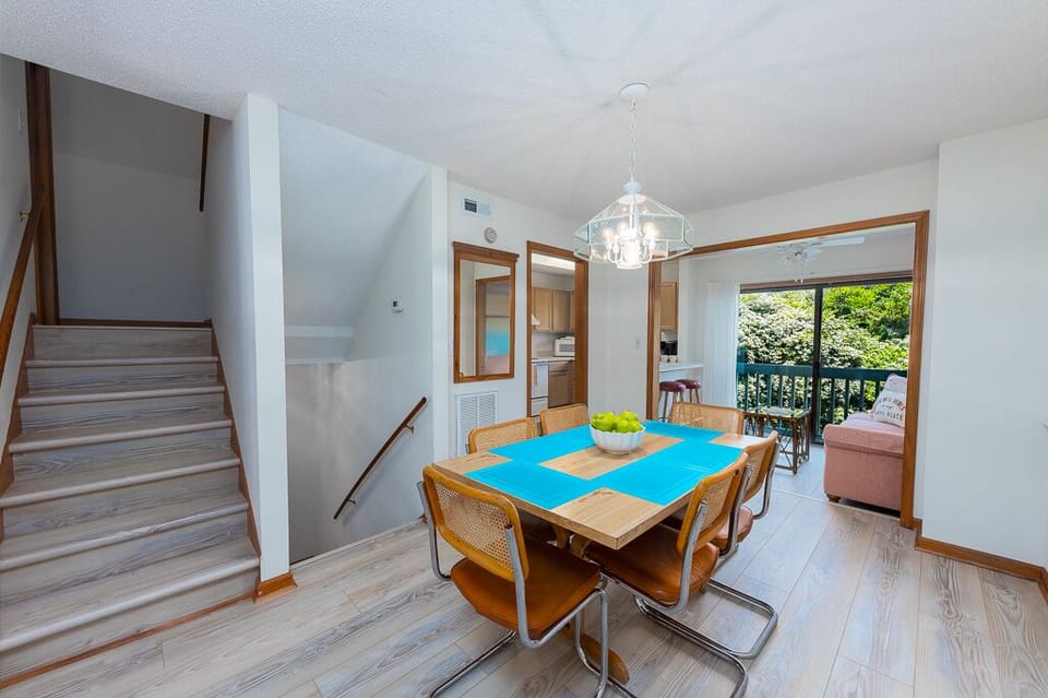 Dining Room with Kitchen and Sun Room in background