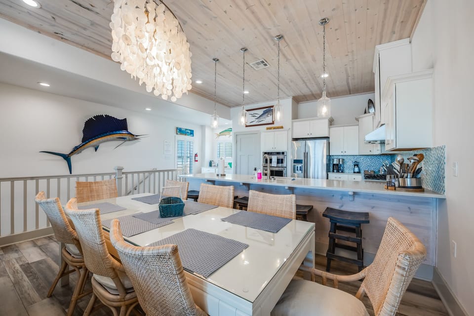 Dining Room has seating for 8 plus 4 additioal stools at the kitchen peninsula