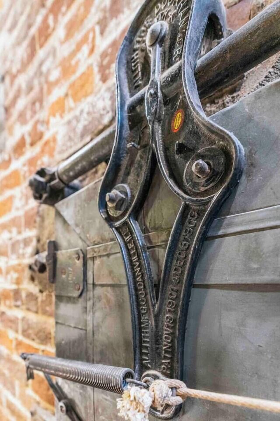 We love this original fire door and the cool hardware!