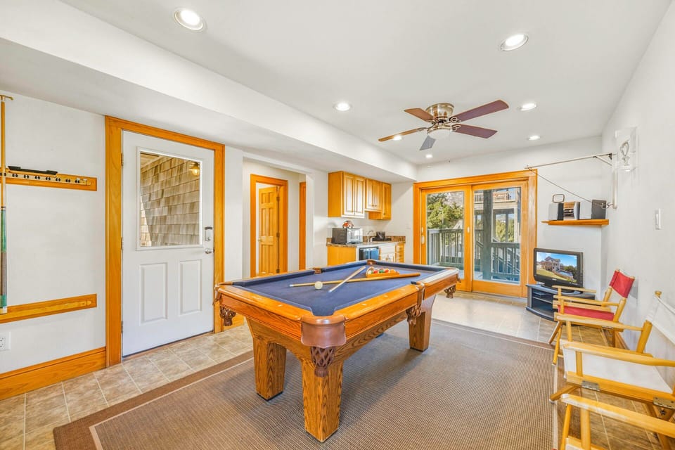 Your private game room awaits with a professional pool table, cozy seating, and entertainment center for memorable evenings.