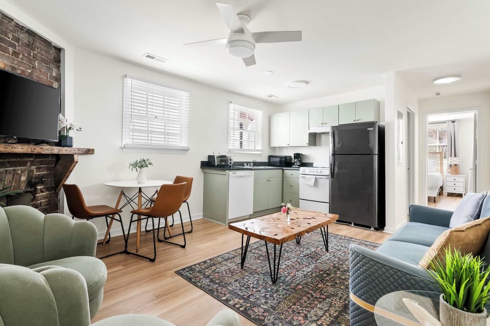 Open space layout featuring living room with plenty of seating space for your group, TV and dining and seating for three