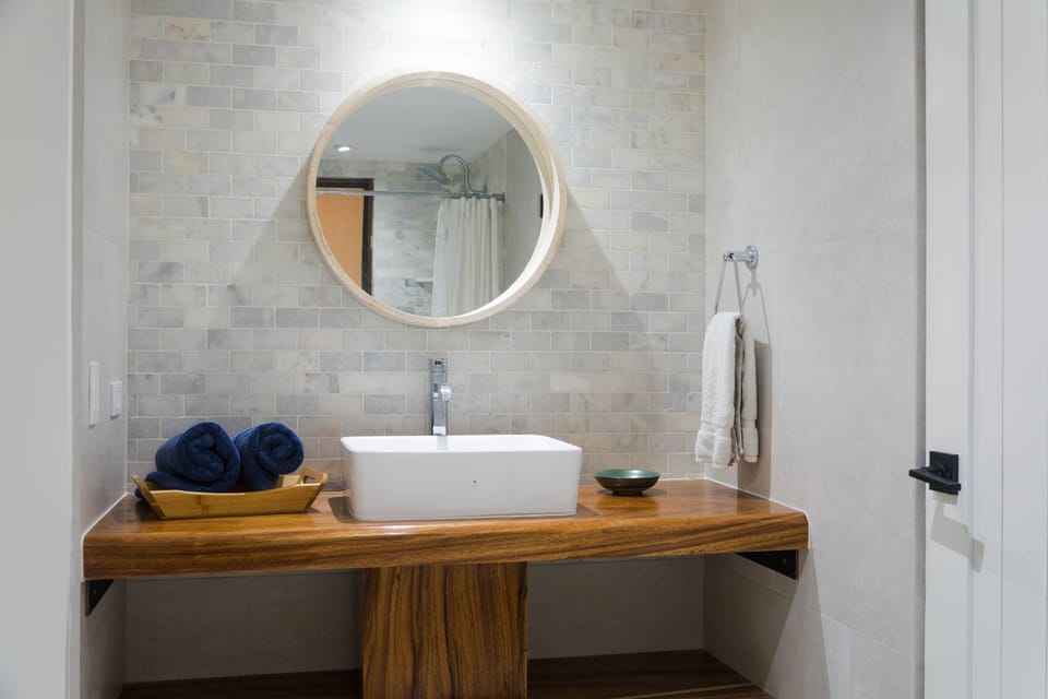 Full bath #1 adorned in marble and handmade wooden vanity