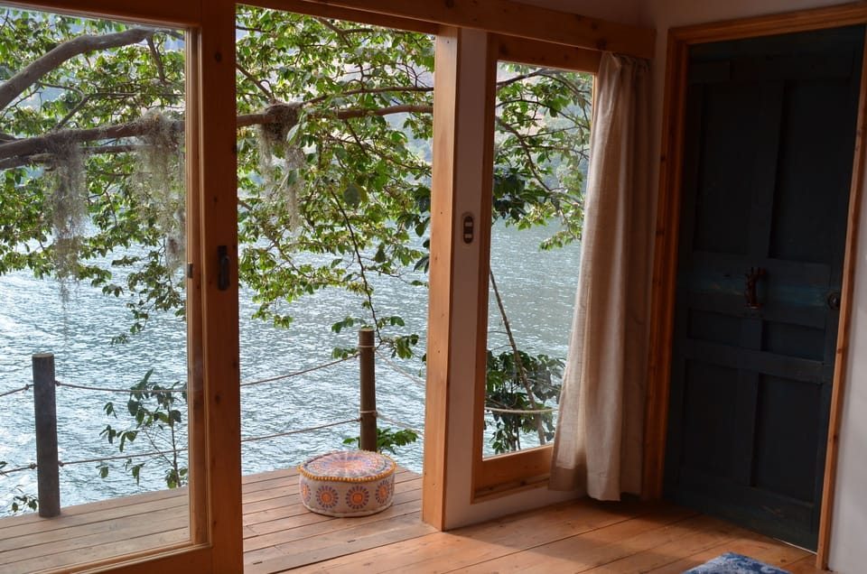 Bdrm with sliding door to the wooden deck, sit and feel inspired