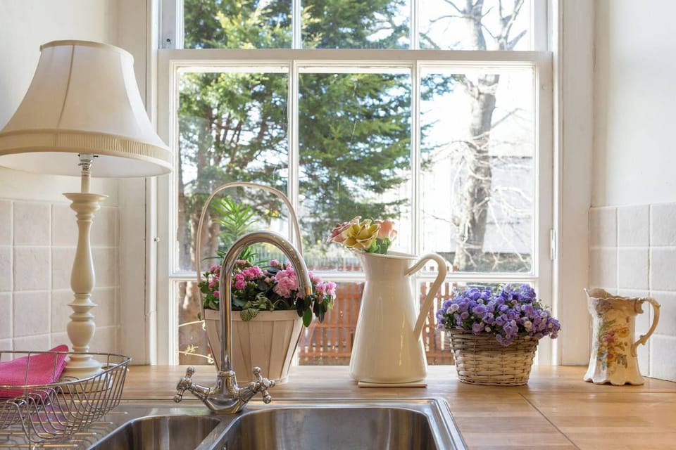 The kitchen looks over walled gardens