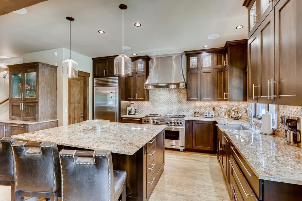 6 burner gas stovetop and double oven and large breakfast island.