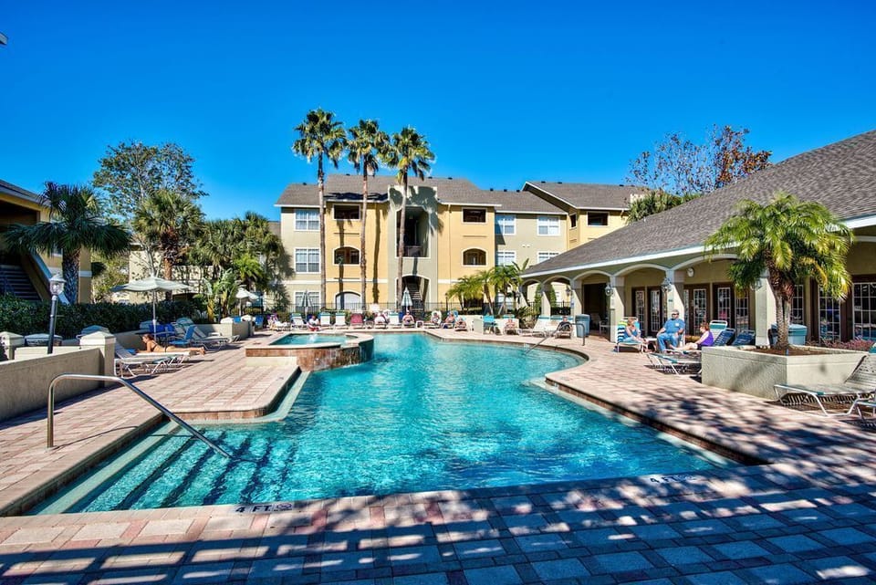 The Avalon complex pool with modern new chairs and umbrellas