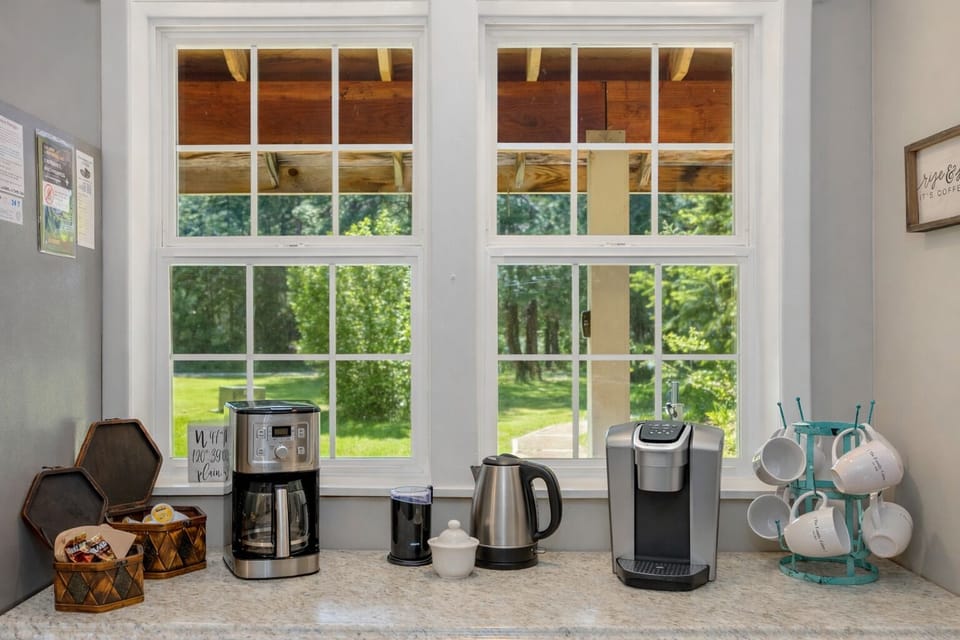 Your morning coffee ritual awaits at this charming beverage station, complete with fresh grounds and peaceful garden views to start your day.