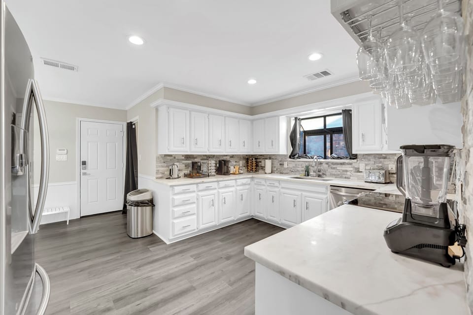 Large kitchen with smart fridge smart microwave smart oven smart dishwasher
