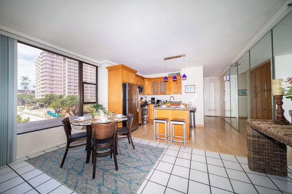 Spacious kitchen complete with stainless steel appliances and wooden cabinets