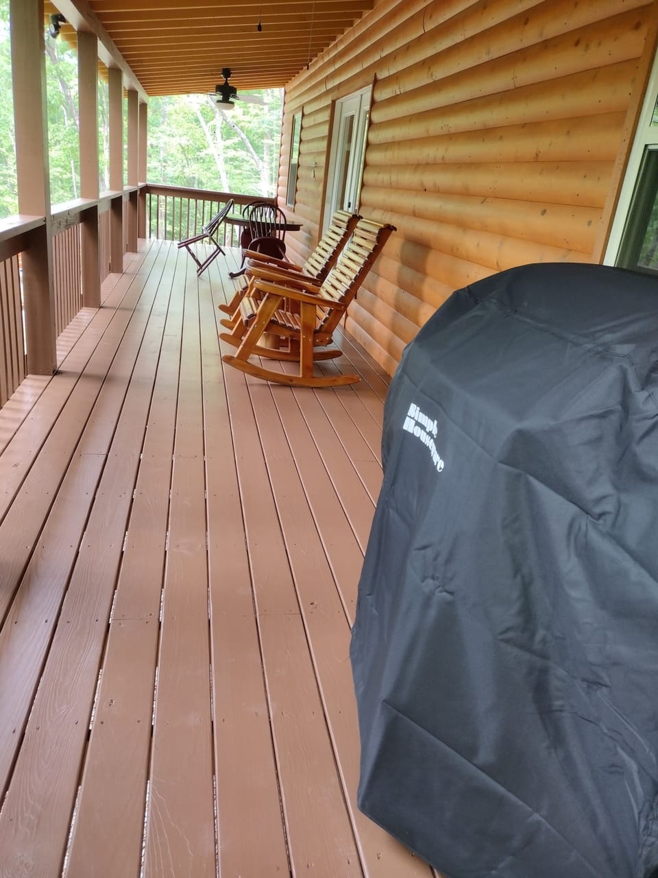 Freshly painted balcony/porch with 2 rockers, picnic table (new) and gas grill.