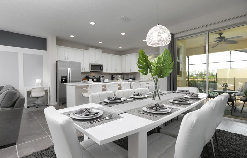 Dining room seats 8, connects to living room and kitchen; 4 seats at counter.