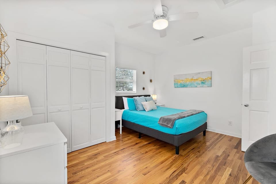 Bedroom with queen bed and memory foam mattress.