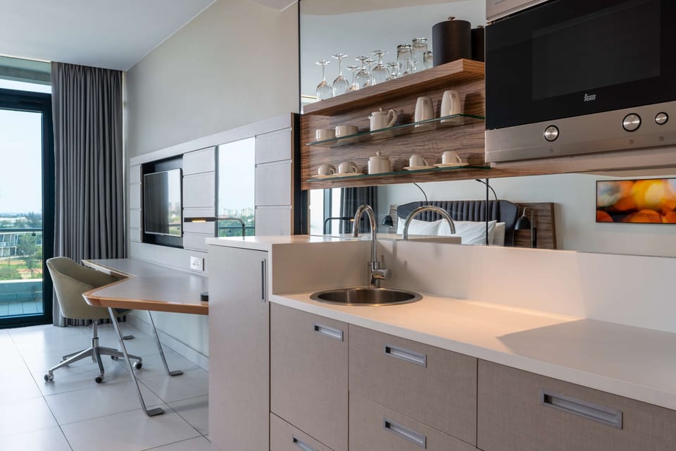 Studio, Balcony, City View | Minibar, in-room safe, desk, laptop workspace
