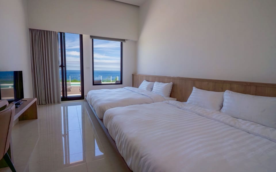Quadruple Room with Sea View Balcony | Premium bedding, down comforters, memory foam beds, desk