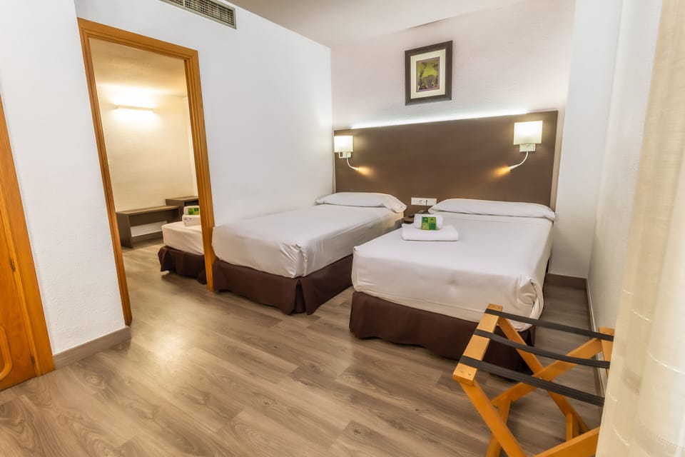 Standard Triple Room, 3 Twin Beds (for 2 adults and 1 child) | 1 bedroom, down comforters, minibar, in-room safe