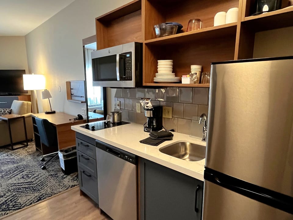 Desk, laptop workspace, blackout drapes, iron/ironing board