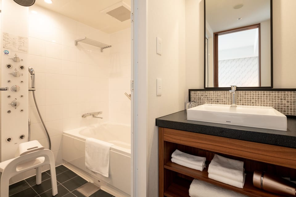 Free toiletries, hair dryer, slippers, electronic bidet