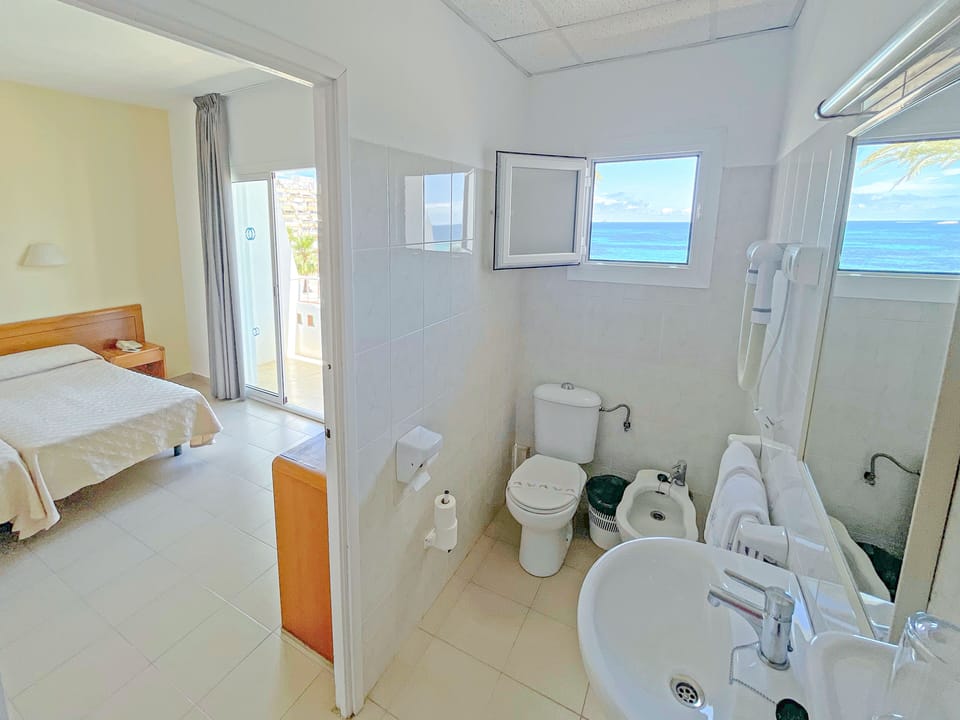 Standard Double Room, Sea View | Desk, blackout drapes, iron/ironing board (on request), WiFi (free)
