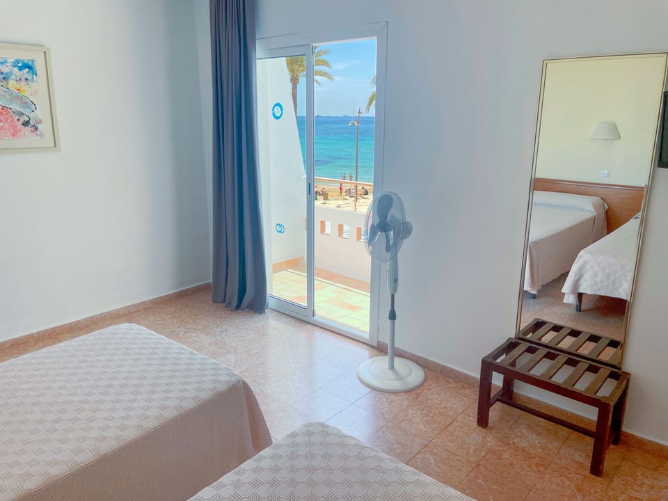Standard Double Room, 2 Twin Beds, Partial Sea View | Desk, blackout drapes, iron/ironing board (on request), WiFi (free)
