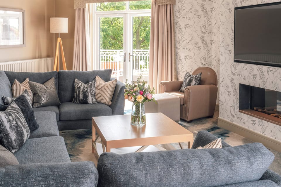 The Belfry Suite | Living area | 32-inch plasma TV with satellite channels, TV