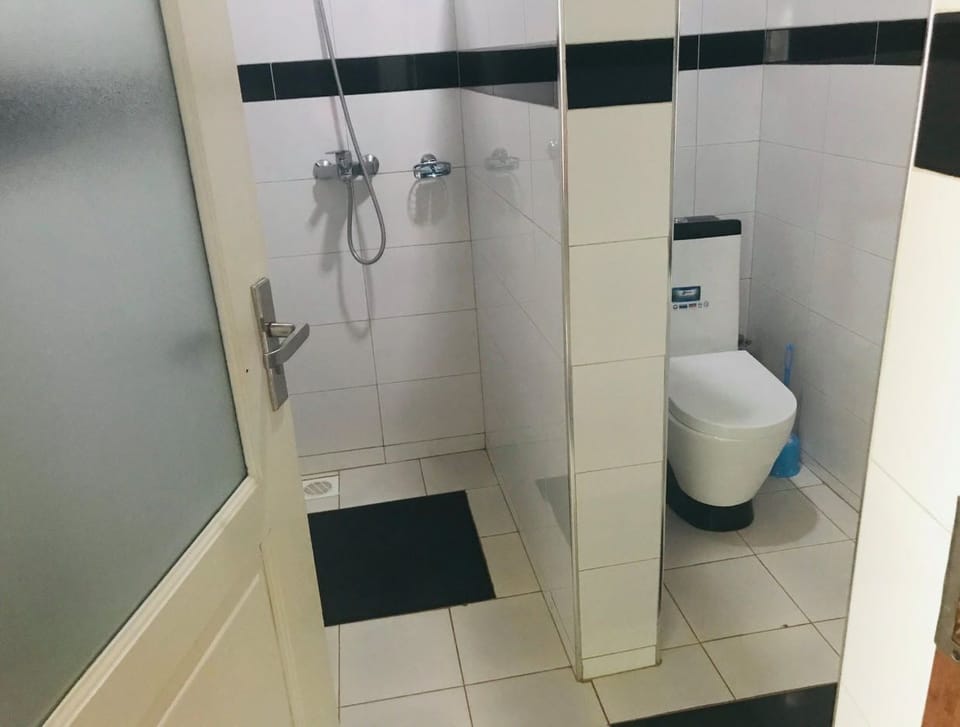 Shower, slippers, towels, soap