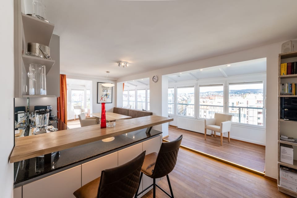 Panoramic Penthouse, 2 Bedrooms, Patio, City View | Living area | Flat-screen TV, heated floors