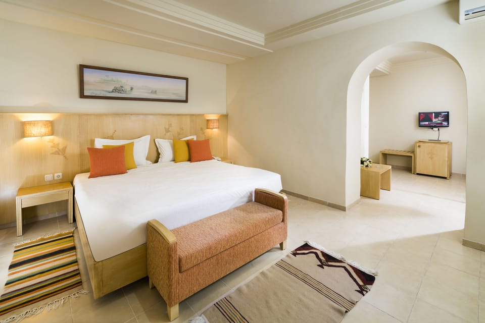 Minibar, desk, blackout drapes, bed sheets